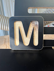 Large single letter plywood sign